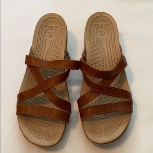 Women’s crocs slip on brown leather wedges, size 9